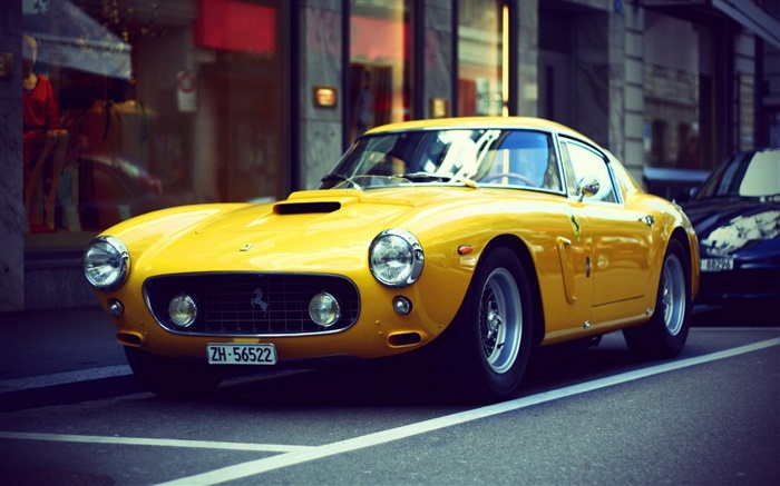 Ferrari gelbe Retro-Auto auf der Straße Hintergrundbilder Bilder