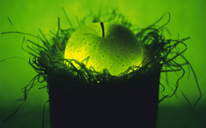 Leichte Obst, grüner Apfel im Nest Hintergrundbilder Bilder